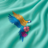 Camiseta infantil oversize color menta con el diseño «Frida Parrot»